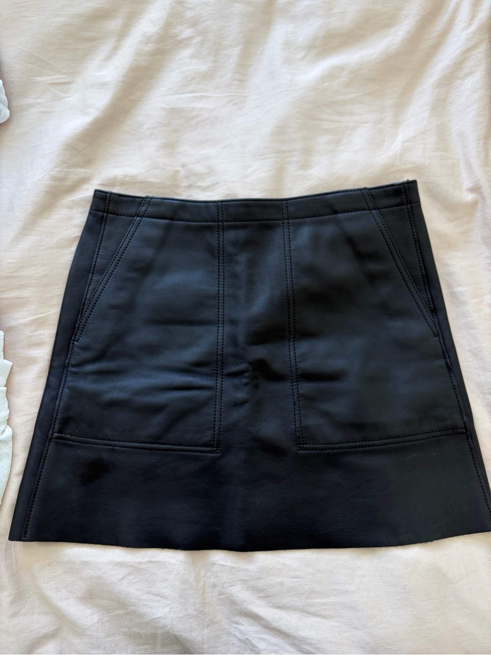 Coach Black Genuine Leather Mini Skirt with Topstitch Paneling and pockets